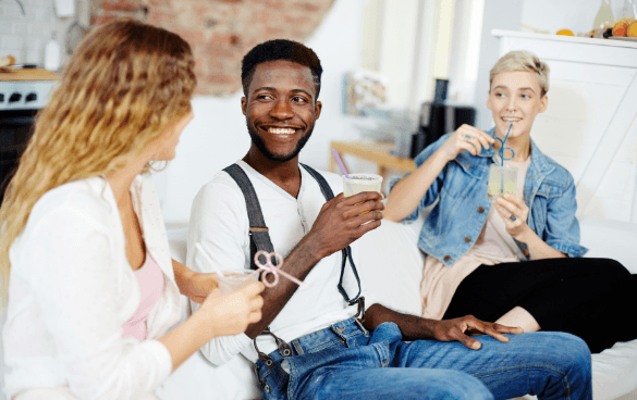 People sitting on a couch talking